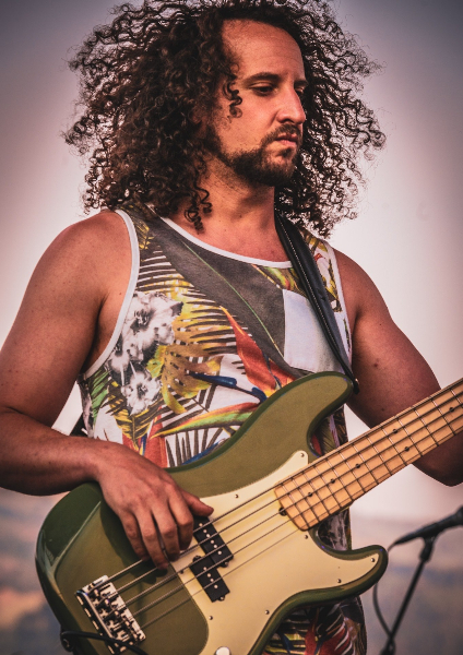 Josh Fairman performing with an electric bass