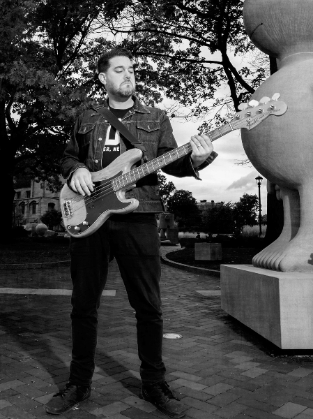 James Searl playing bass outdoors